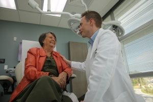 Doctor seeing patient at the skin care treatment center in orlando.